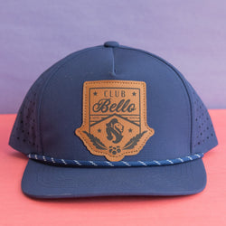 Navy rope hat with leather patch featuring Club Bello logo.  